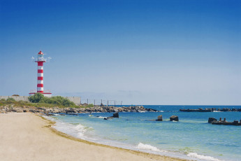 Картинка природа маяки небо волны камни маяк море пляж берег песок