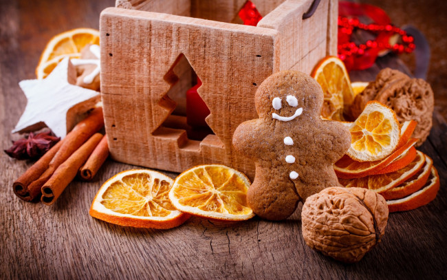 Обои картинки фото праздничные, угощения, орех, корица, апельсин, человечек, пряничный