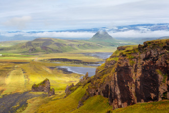 Картинка природа горы исландия трава цветы небо облака склоны скалы