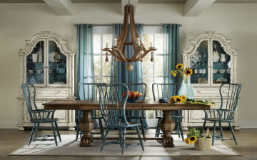 Картинка интерьер столовая люстра шкафчики посуда обеденный стол стулья подсолнухи