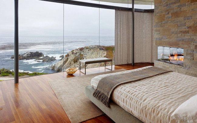 Обои картинки фото интерьер, спальня, море, скалы, лаконичный, камин