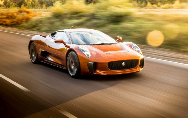 Обои картинки фото автомобили, jaguar, шоссе, трасса, дорога, скорость, Ягуар, оранжевый