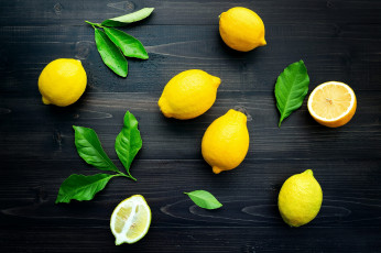 Картинка еда цитрусы листья темный фон доски фрукты лимоны