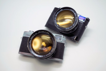 Картинка бренды canon блики пара фотоаппараты камеры кэнон