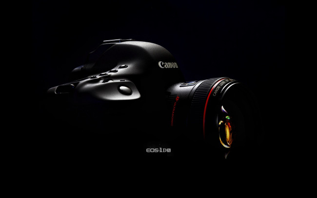 Обои картинки фото бренды, canon, черный, фон, фотоаппарат, 2l, ef, 50mm, f1, объектив