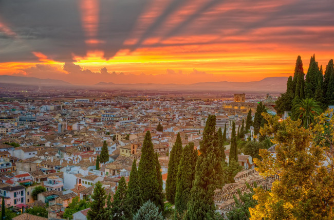 Обои картинки фото испания, города, панорамы, spain, закат, деревья, кипарисы, здания, дома