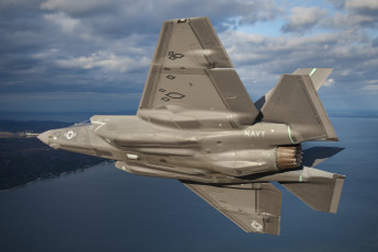 Картинка авиация боевые+самолёты американец бомбардировщик берег пейзаж lightning ii f-35 море тучи небо полет