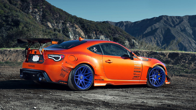 Обои картинки фото автомобили, scion, оранжевый, горы