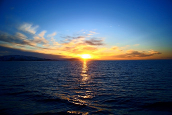 Картинка природа восходы закаты море залив волны берег небо закат