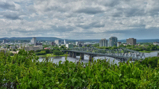 Обои картинки фото nubes sobre el rio, города, - панорамы, река, мост