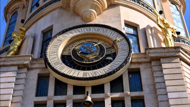 Обои картинки фото astronomical clock in the old building on the europe square batumi, города, - здания,  дома, часы, башня, здание
