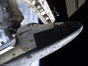 Картинка the space shuttle discovery docked to destiny laboratory of international station космос космические корабли станции