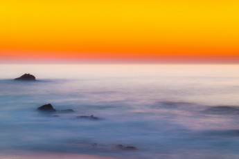 Картинка природа моря океаны камни море горизонт зарево небо закат